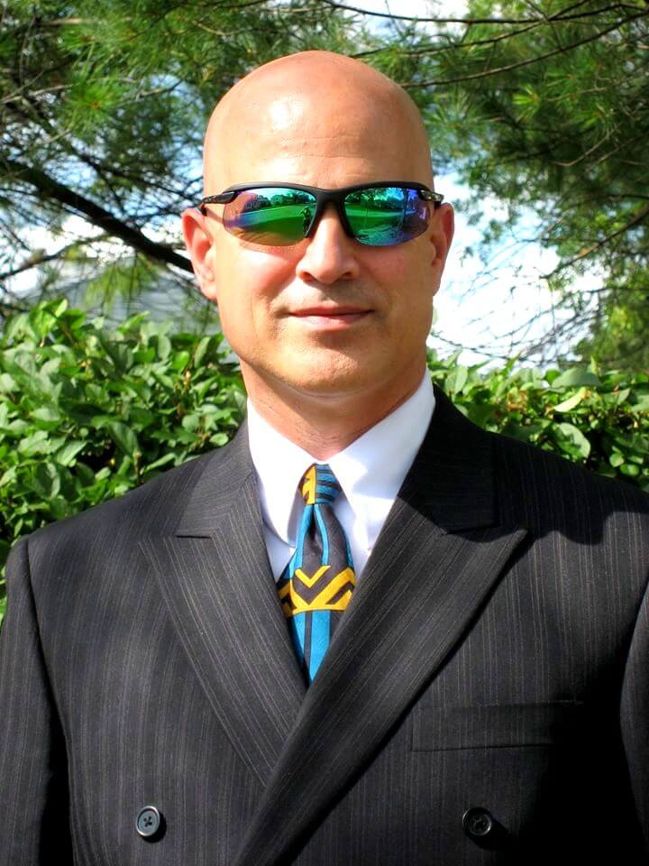 Photo of Steven C. Adamko - Interior Designer with Suit and Sunglasses